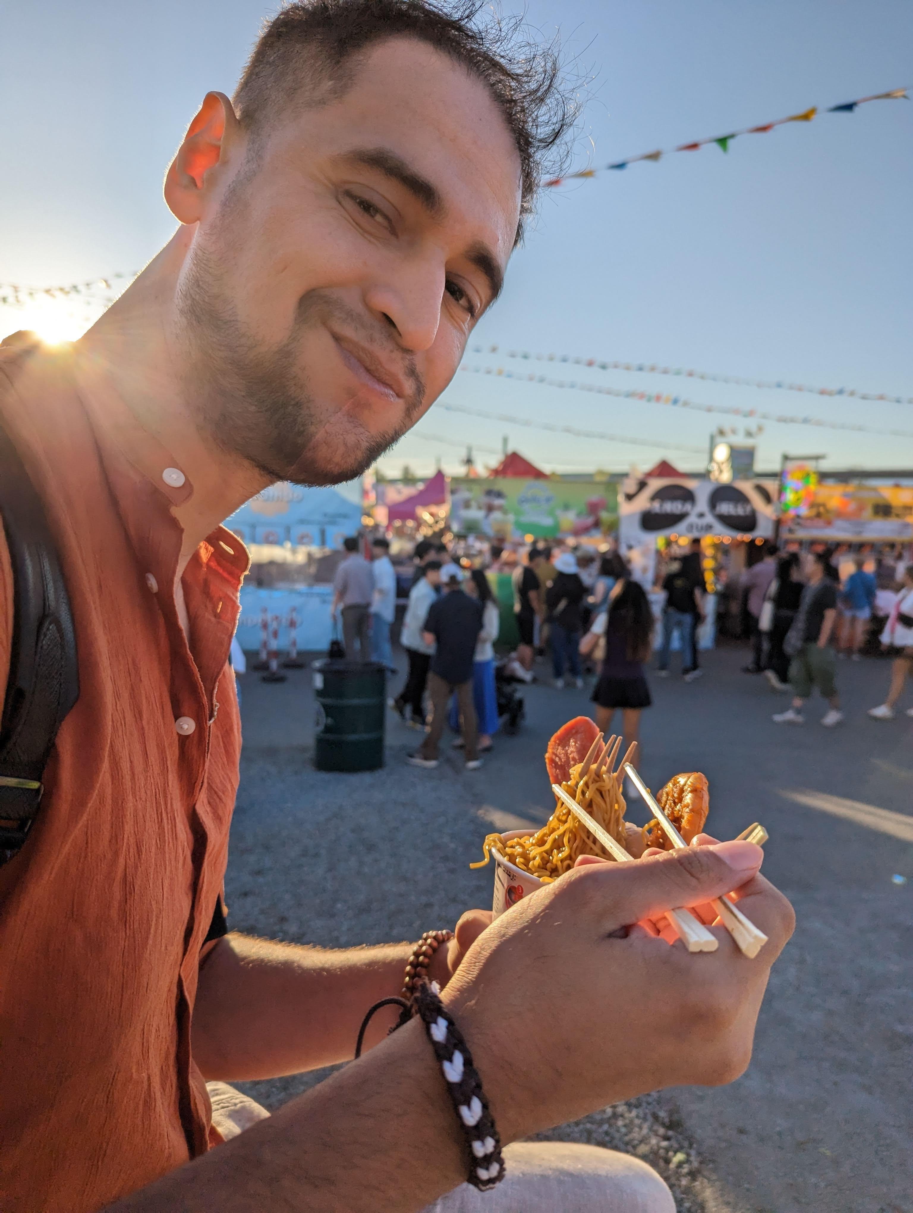 a portrait of me eating ramen at the richmond night market